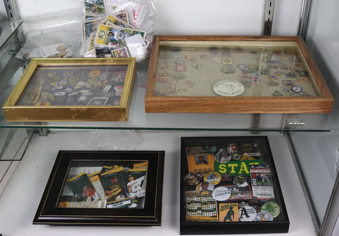 Two shelves of baseball and other collector's pins and Oakland A's ticket stubs (1 of 1)