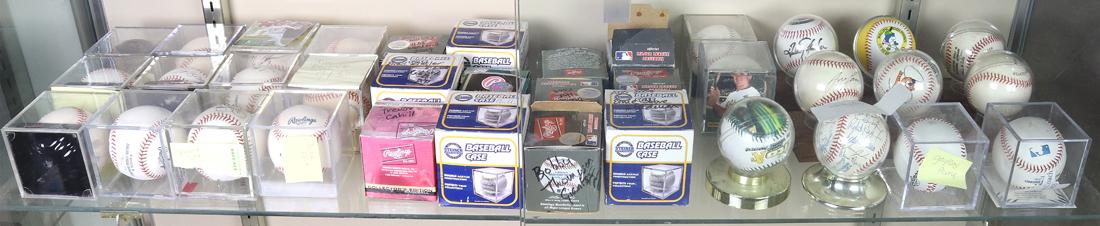 (lot of 36) One shelf of baseballs mostly bearing autographs: (lot of 36) One shelf of baseballs mostly bearing autographs, including examples with Jim Mudcat Grant, Tim Raines, Terrance Long, Brad Zigler and Gaylord Perry, etc. Provenance: Property from the col