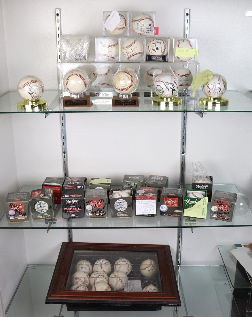 (lot of 43) Three shelves of baseballs mostly bearing autographs (1 of 1)