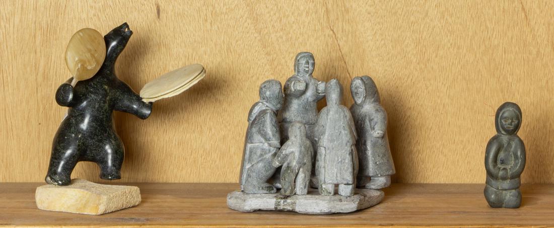 (lot of 3) Inuit carvings: (lot of 3) Inuit carvings, consisting of serpentine, horn, hide and bone figure of polar bear drum dancer, indistinctly signed, 7"h; family group, 6"h and an eskimo, 4"h.