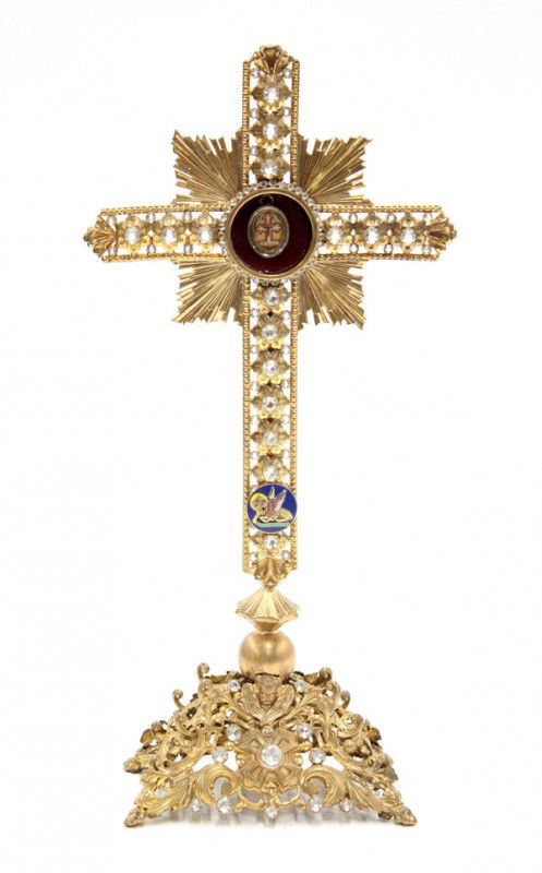 Religious crux gemmata reliquary: Religious reliquary with a gold gilt finish and encrusted with faceted glass stones, in the form of a crux gemmata, with a monstrance, displaying a first class relic, 'S Crucis', note: you are purchas