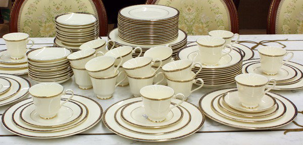 Mintons china service: (lot of 106) Mintons ''Saint James'' table service for twenty four, each having a partial gilt and cobalt decorated rim on a cream ground, consisting of dinners, salads, breads, ten soups, and cups wi