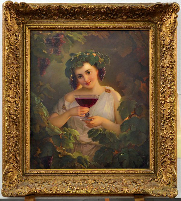Framed KPM porcelain plaque: Framed KPM Berlin porcelain plaque circa 1900, depicting a bacchanalian nymph bearing a goblet of wine and surrounded with flowing grape vines and bountiful fruit clusters, signed lower right Bauer, v