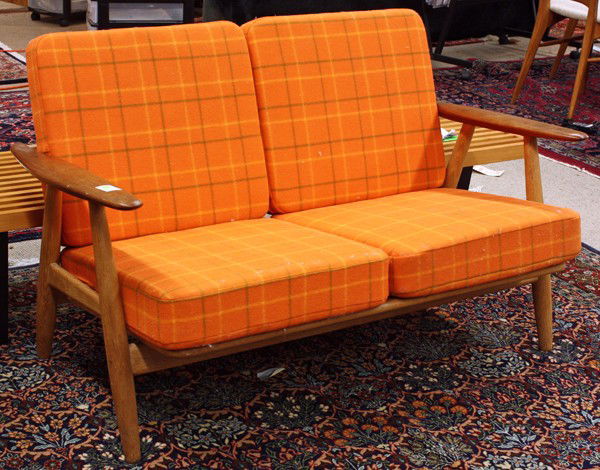 Hans Wegner love seat: Hans Wegner loveseat, executed in teak and oak and retains period upholstery, signed Getama Gedsted, Denmark, Designed Hans Wegner, 30''h x 47''w x 30''d