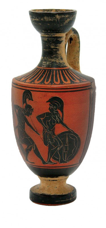 Etruscan style redware squat lekythos: Etruscan style redware squat lekythos, with a disc foot, and a partial frieze, comprising two Etruscan soldiers and a servant, each soldier wearing a short tunic, greaves, cuirass, and high crested co