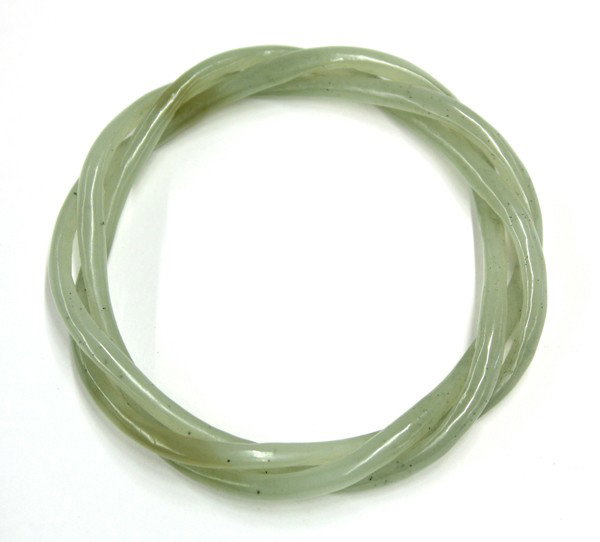 Chinese Interwoven Jade Bangle: Chinese celadon jade bangle bracelet, shaped as three interwoven strands rendered from a pale sea-green matrix with minute dark flecks, overall: 3''dia