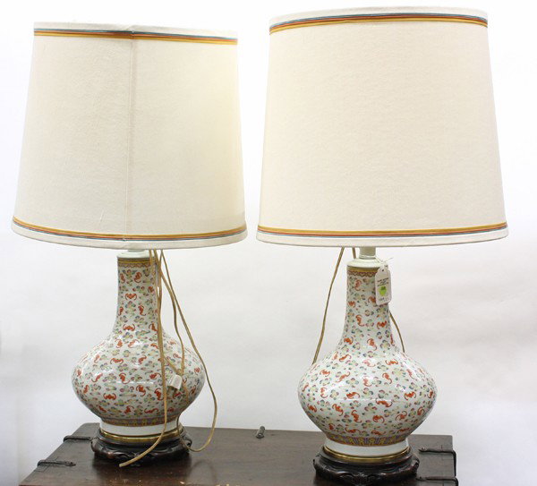 Pair of Chinese Enameled Vases, One Hundred Bats,: Pair of Chinese polychrome enameled porcelain stick-neck vases (now mounted as lamps), late Qing/Republic period, each compressed globular body surmounted by a cylindrical neck and painted overall wit