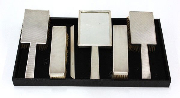 Sterling dresser set: English sterling silver deco six piece dresser set, 1930's London, by W & H, possibly Walker & Hall, comprising two hair brushes, clothes brush, shoe bursh, hand mirror, and a reticule