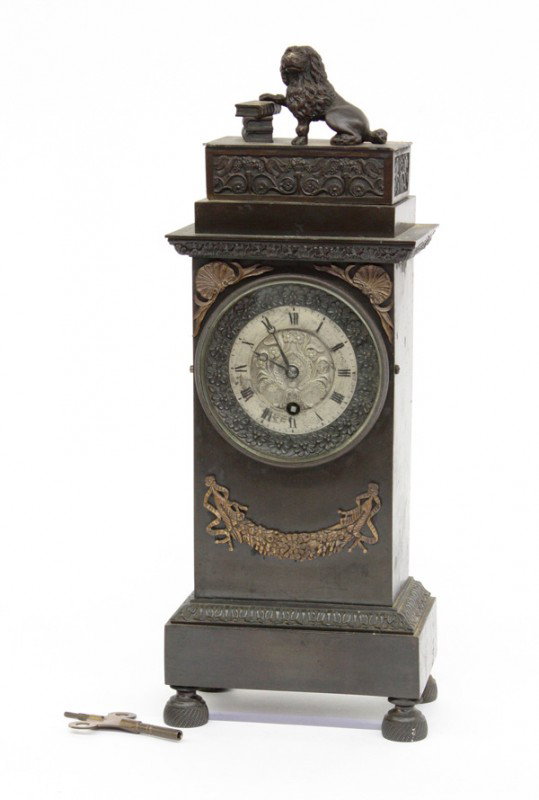 French clock: French clock, in the Louis XVI form, in a bronze finish with ormolu mounts, 15''h