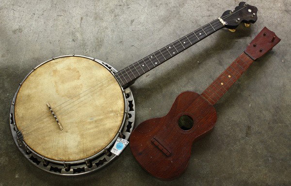 Banjo and Ukulele: (Lot of 2) Banjo and Ukulele group, the unsigned ebonized four string banjo together with a Victor Hawaiian ukelele