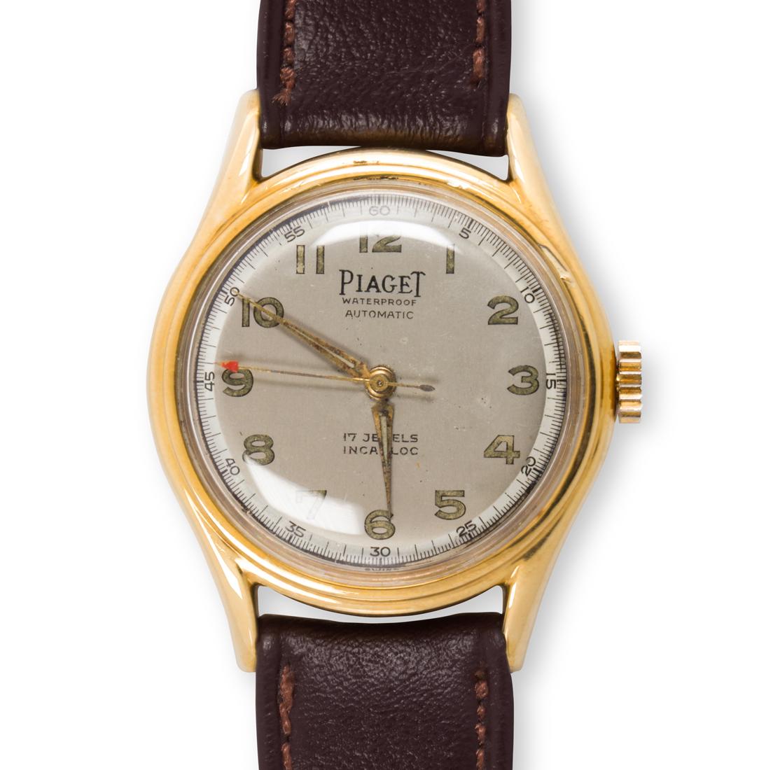 A fourteen karat gold wristwatch, Piaget: A fourteen karat gold wristwatch, Piagetthe dial with numeral hours, dash or Arabic numeral minutes/seconds, within polished case, containing a seventeen jeweled Incabloc automatic movement; no. 1145,