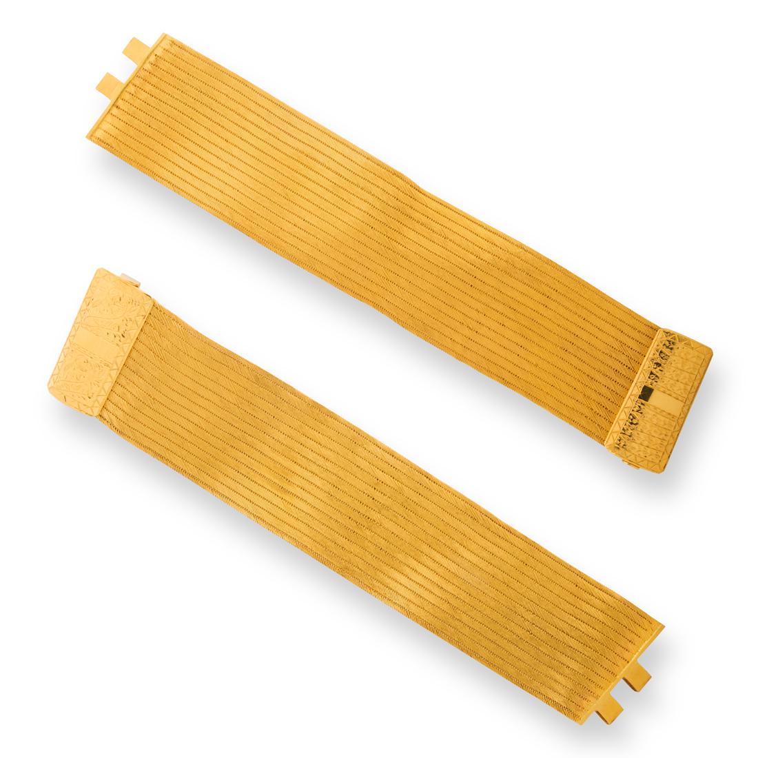 A pair of twenty-two karat gold strap bracelets (1 of 3)