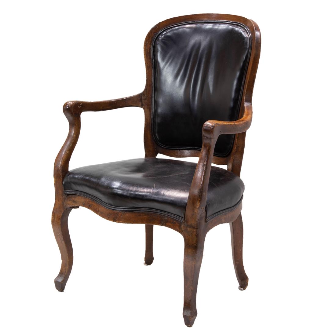 A Louis XV style leather upholstered fauteuil: A Louis XV style leather upholstered fauteuil, first half 19th century, with later leather upholstery, and rising on cabriole legs, 37"h x 24"w x 19"d