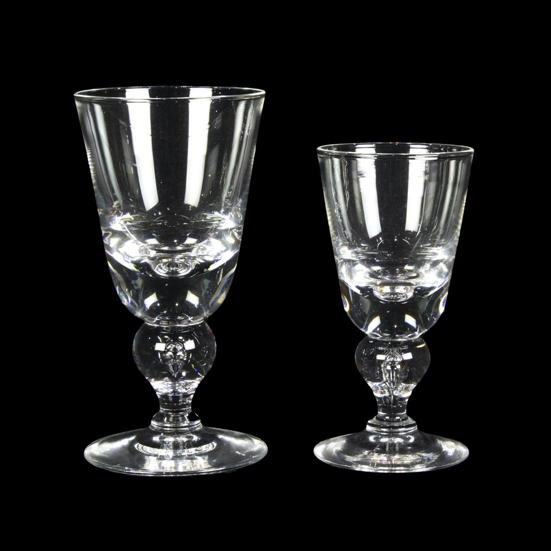 (Lot of 19) Steuben glass stemware designed by George Thompson: (Lot of 19) Steuben glass stemware designed by George Thompson, each with baluster stem comprising (11) goblets 7877, 6.75"h and (8) wine 5.75"h.