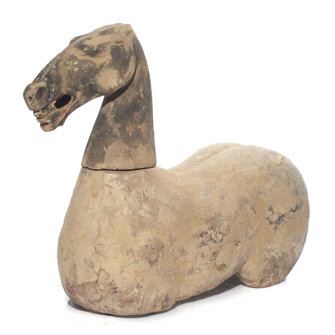 Chinese Han dynasty figure of a horse with movable head: Chinese Han dynasty figure of a horse with movable head, 18"h. x 20"l.