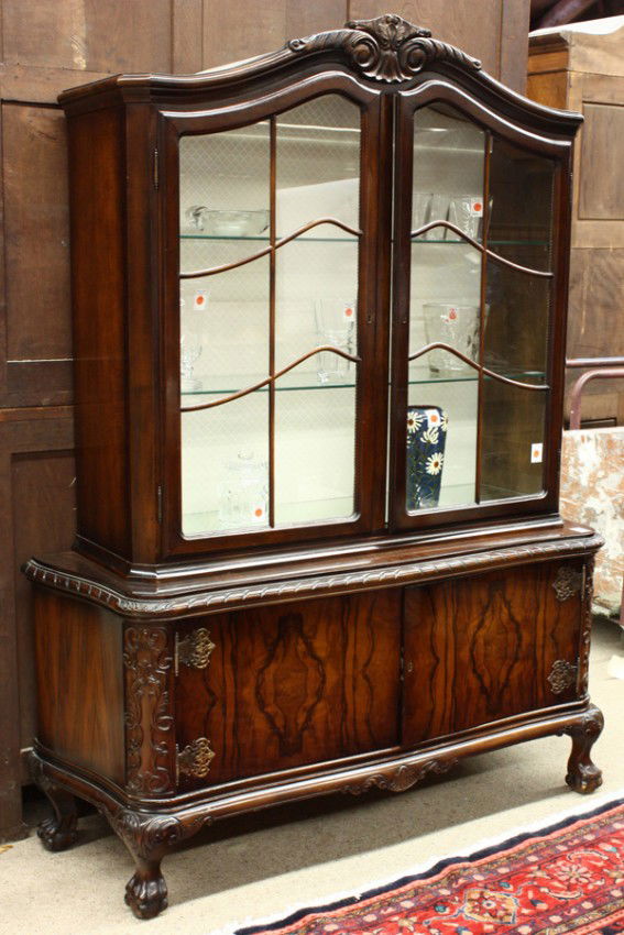 Art Deco cabinet, sideboard: (lot of 2) Art Deco china cabinet circa 1930, having a molded two door top above the lower case having book matched rosewood door panels flanked with relief carved reserves and rising on carved ball a