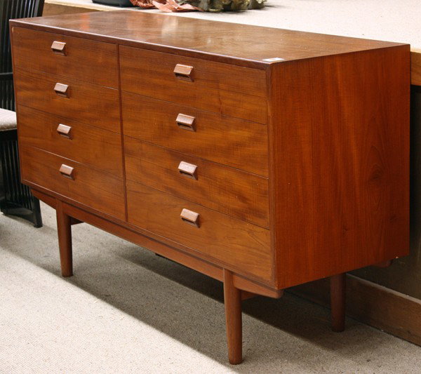 Borge Mogensen Danish teak dresser: Borge Mogensen (1914-1972), Danish teak dresser, circa 1960, the rectangular case is divided equally into two sections, each section with four drawers, for a total of eight drawers, and the cabinet ra