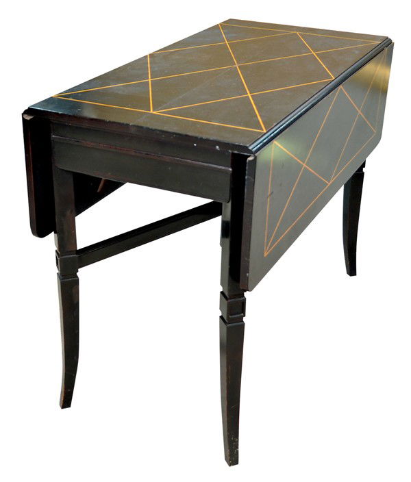 Tommi Parzinger, Charak Danbury table: Tommi Parzinger (1903-1981) for Charak, Danbury drop leaf dining table, with an ebonized finish, the surface with a geometric fruitwood inlay, contained within a fruitwood border, and rising on square