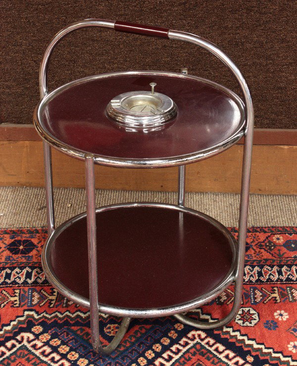 Howell Art Deco smoking table: Howell Art Deco smoking table, constructed of tubular chrome steel, with two shelves, the top shelf with an automatic tobacco ashtray, and each shelf with a burgundy enamel finish, original Howell lab