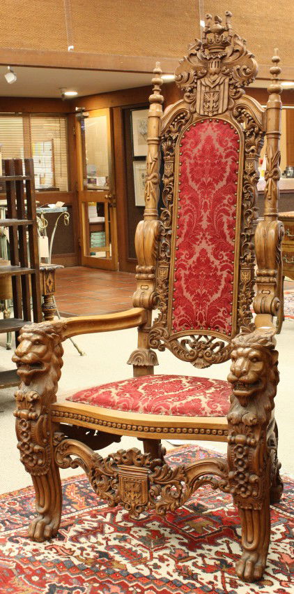 Renaissance Revival throne chair: Renaissance style throne chair, having a relief carved crest depicting German heraldry above the upholstered back surrounded with a pierce carved border with German eagle shields, flanked by the full