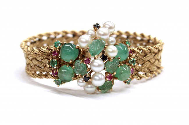 Yellow gold braided bracelet beryl pearl sapphire: Carved and cabochon beryl, cultured pearl and sapphire cluster clasped braided bracelet; of 14k yellow gold, rope trimmed, measuring 1/2'' wide. Total bracelet weight 33.3 grams