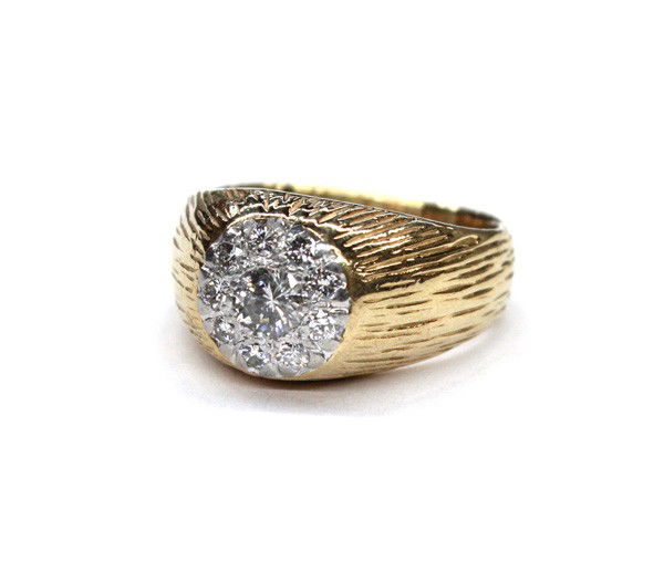Gentleman's diamond yellow gold ring: Gentleman's diamond ring; mounted in 18k yellow gold, set with (1) round brilliant cut diamond weighing 0.33 ct and (9) single cut diamonds weighing 0.36 ct. Total ring weight 12.7 grams. Ring size 7.