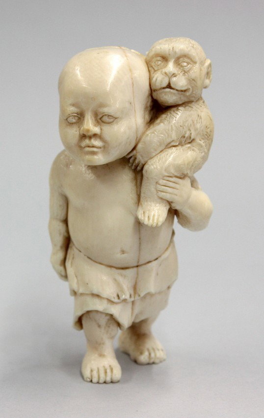 Asian Ivory Figural Carving, Early 20th C: Asian ivory figural carving, early 20th century, realistically carved as a South Sea islander walking in a short skirt-like garment and carrying a gibbon on his bare shoulder, with incised details (ag