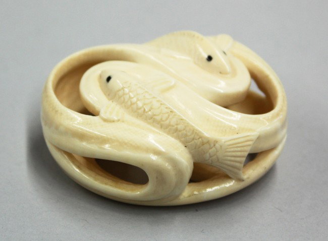Japanese Ivory Netsuke, Fish, Signed: Japanese contemporary ivory netsuke, mid-20th century, well carved and pierced as two carp swimming along eddies of a stream, the openings serving as the himotoshi, signed Kochu/Hironaka, 2''l