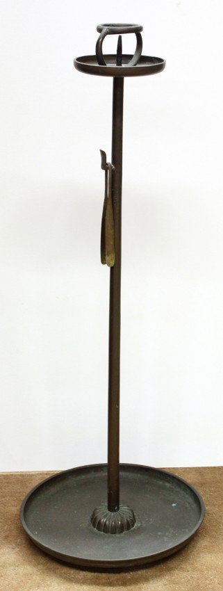 Japanese Tall Bronze Candle Stand: Japanese tall bronze candle stand, probably Edo period, with a small dish raised on a slender tubular support above a foliate form pedestal set above a larger dish form base, the support further suspe