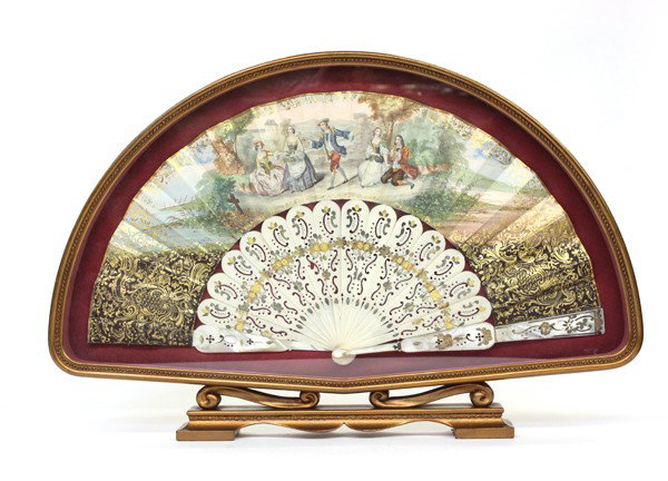 Shadow box with Victorian fan: Gilt framed shadow box displaying a Victorian celluloid and mother of pearl fan having a transfer courting scene