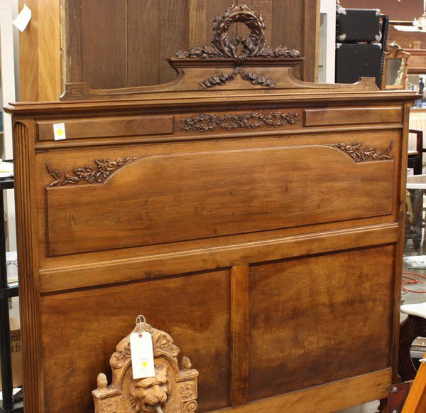 Louis XVI style bedroom suite: Louis XVI style walnut, the bed having a carved wreath and bow form crest above the panelled and relief carved headboard, inside dims 60.5''w x 81''l, overall 61''h