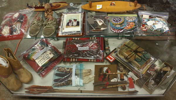 Native American collection: Southwest and Native American collectibles including buffalo boots, beaded moccasins, circa 1930 blankets and textiles, ephemera, books beaded necklaces, cuffs, medallions, arrowheads, arrows, and sou