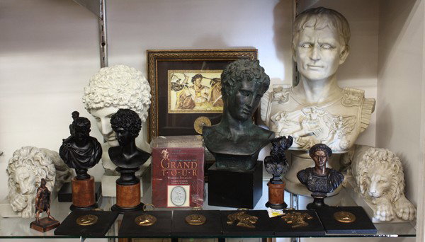 Classical sculptures & Alexander the Great Drachm: (1 shelf) Associated classical sculptures, including a pair of Nemean lions, heroes of antiquity, including Ajax, Caesar, Adonis, a sealed pack of Grand Tour warrior intaglios, 6 wall hangings, includ