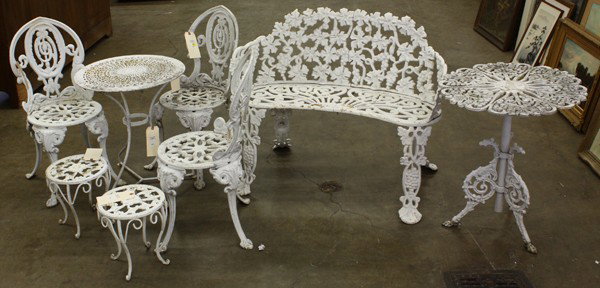 Cast iron parlor set: (Lot of 8) Cast iron parlor set, including a settee, two open work occasional tables with an additiona, and three childs chairs with tabourets