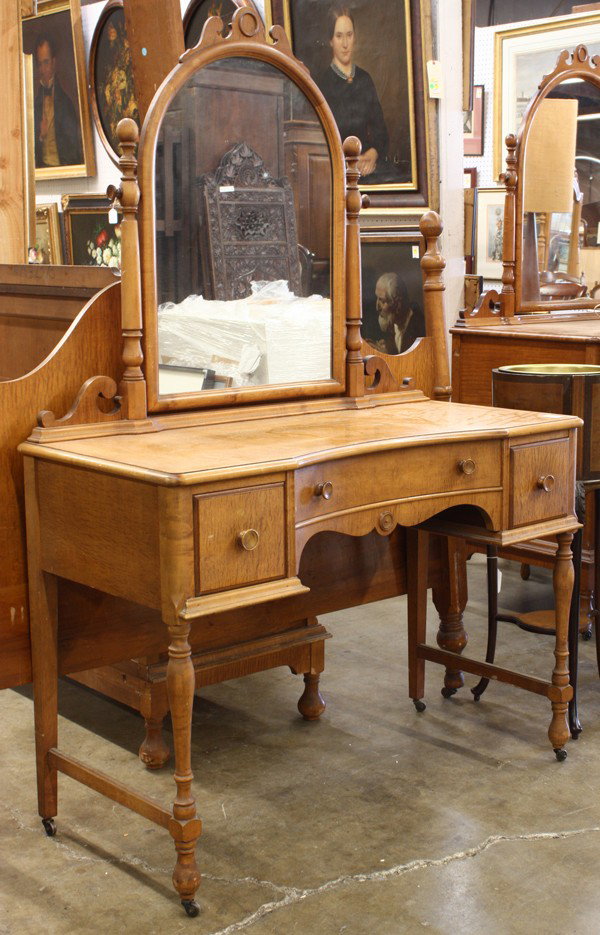 Satinwood bedroom suite: (lot of 5) Satinwood bedroom suite executed in the Early American style and consisting of a mirrored vanity, mirrored chest of drawers, highboy, and bed with bedside table, by Sterling Furniture Compa