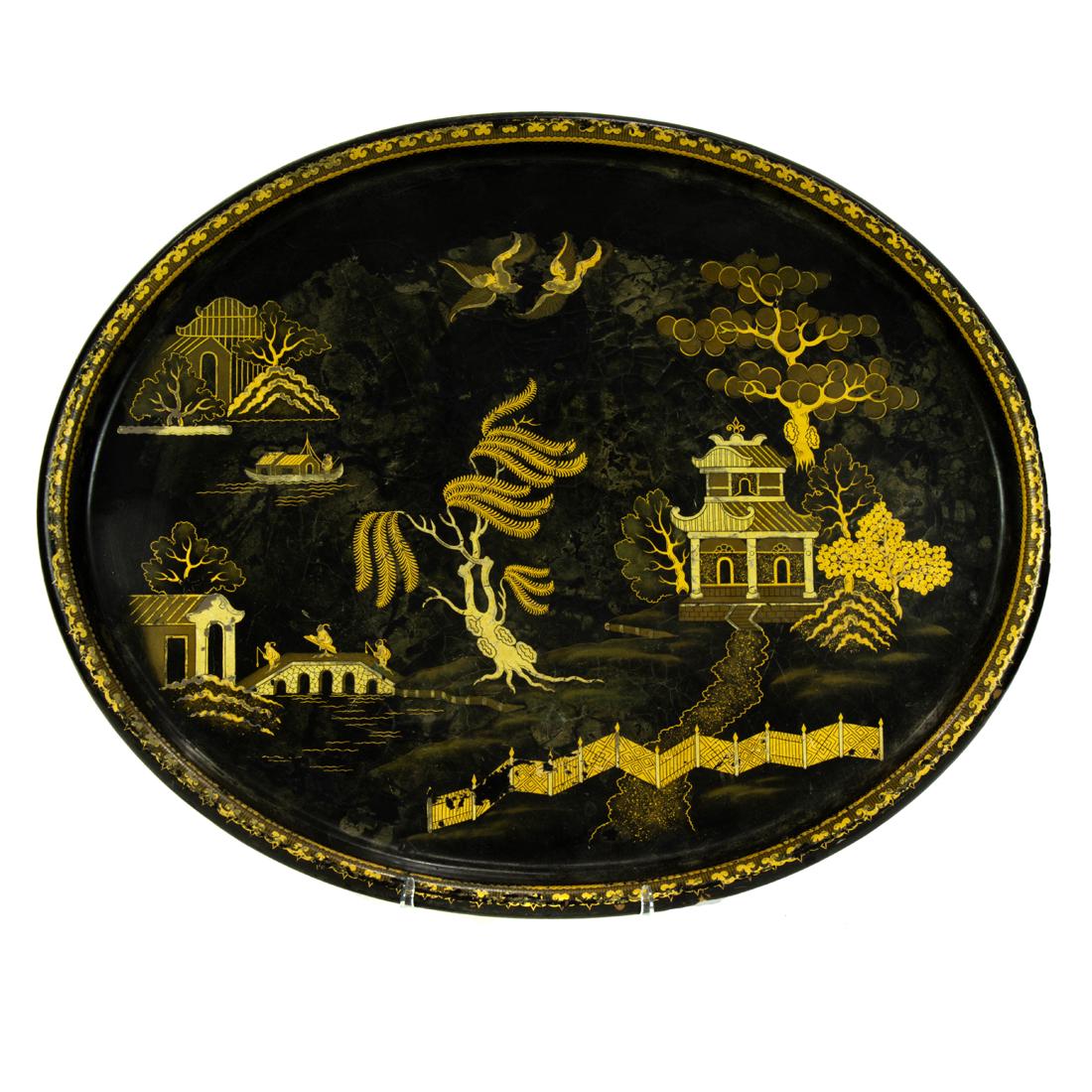An English Chinoiserie decorated papier-mache oval tray: An English Chinoiserie decorated papier-mache oval tray