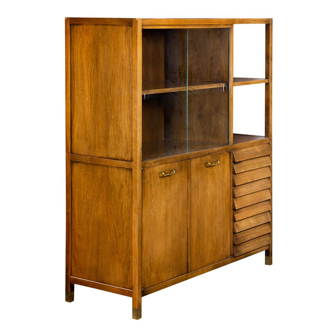 Merton Gershun for Martinsville credenza: Merton Gershun for Martinsville credenza, having two sliding glass doors, opening to a shelved interior, beside an open glass shelf, above the case having two doors with brass pulls, next to four draw
