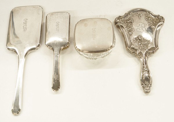 Silver dresser set: (Lot of 4) R. Wallace & Sons sterling silver mounted three piece dresser set consisting of a hand mirror, hair brush, and covered jar, script monogram BFD, together with an associated sterling silver 