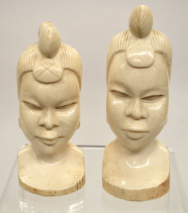 Two carved ivory busts: Two carved ivory busts of African women