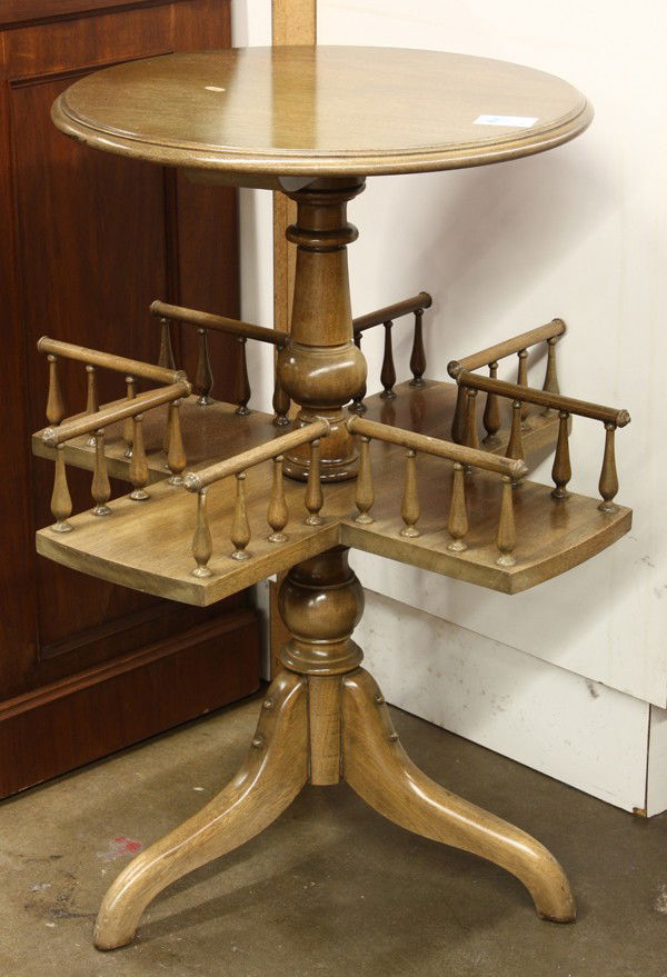 Charles of London library table: Charles of London bleached mahogany library occasional table,the circular top over a four sided revolving reference storage shelf rising on a tripod base, 28''h x 20''w