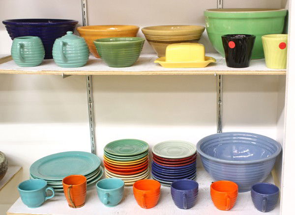 Vintage Bauer pottery tableware: (lot of 47) Vintage Bauer pottery tableware including graduated mixing bowls, plates, saucers, cups, covered butter, creamer, sugar, and flower pots in varius colors