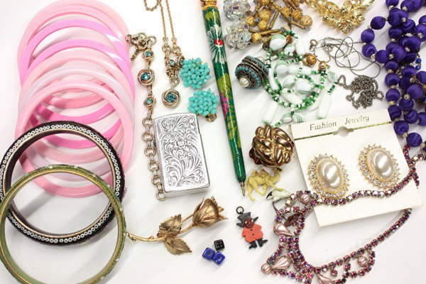 Collection of miscellaneous jewelry items: Collection of miscellaneous costume/fashion jewelry, including; watches by Waltham and Citizen; earrings; broches; necklaces; Laguna set; lighter; etc