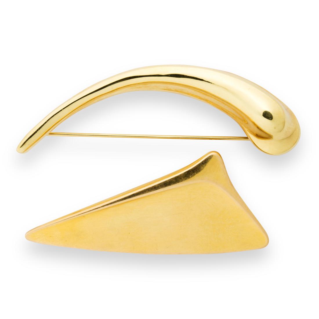 A group of eighteen karat gold brooches: A group of eighteen karat gold broochesthe two brooches of modernist design, including a geometric brooch by Georg Jensen, no. 1327; a freeform brooch by Robert Lee Morris. 22.1 gross dwt; lengths: 2