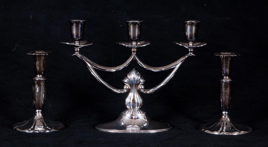 A Finnish silver weighted candelabra and pair of candlesticks (1 of 2)