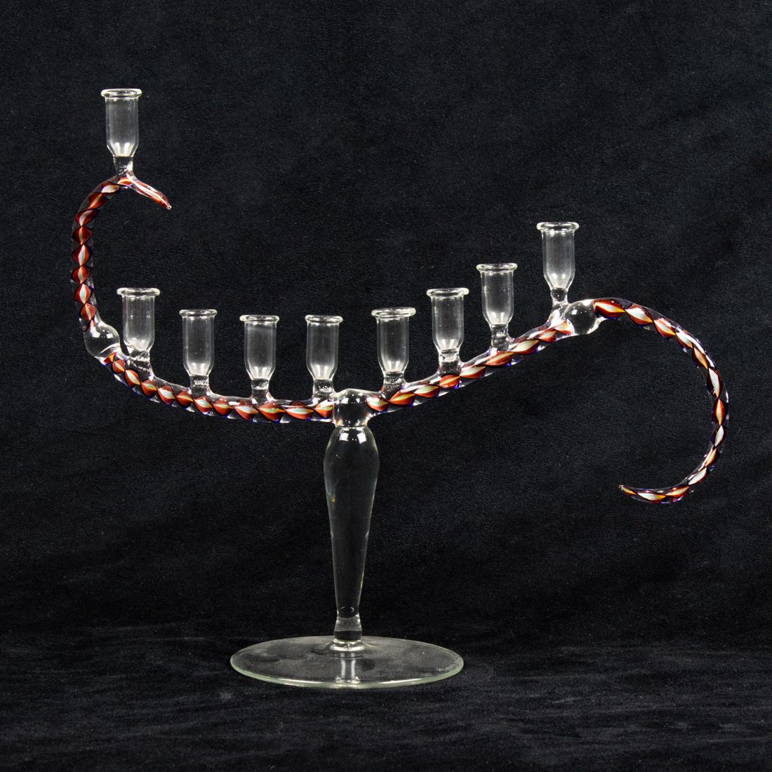 Elizabeth Ryland Mears studio art glass nine-light candelabra dated 2003: Elizabeth Ryland Mears art glass nine-light candelabra, dated 2003, the latticino s-curved arm with candle cups on tapered stand and circular foot, an engraved signature and date 11"h x 12"w