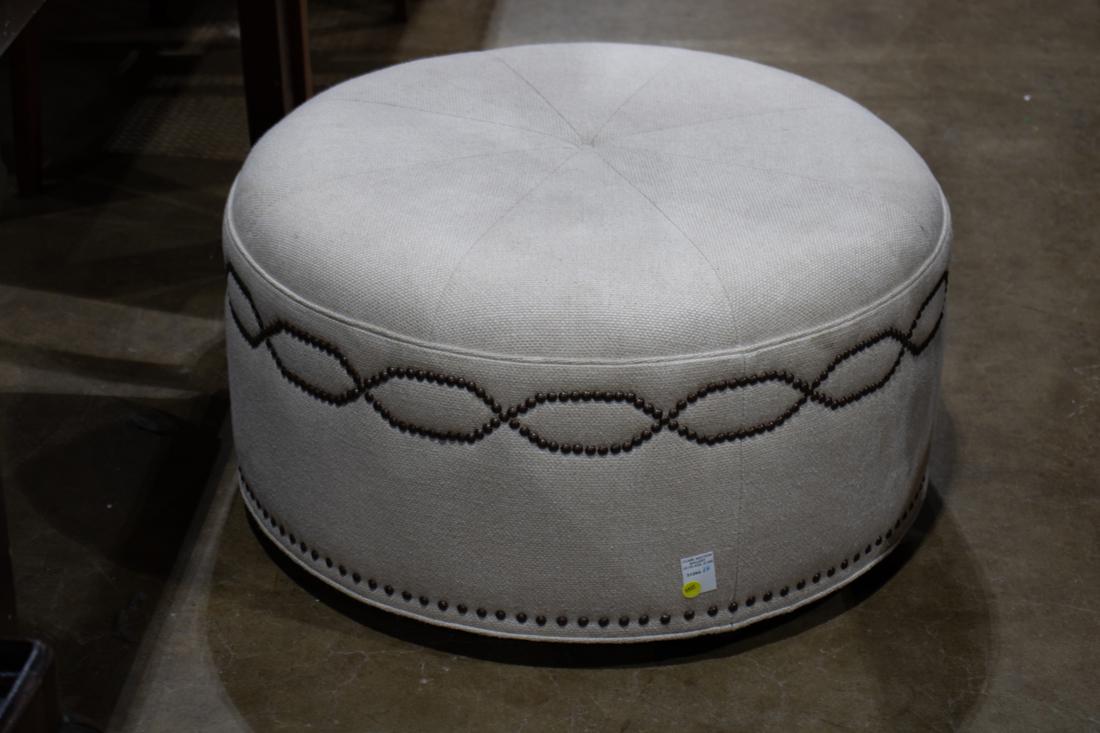 Large Michael Berman round ottoman accented with brass nail head trim: Large Michael Berman round ottoman accented with brass nail head trim, 16"h x 29"dia.