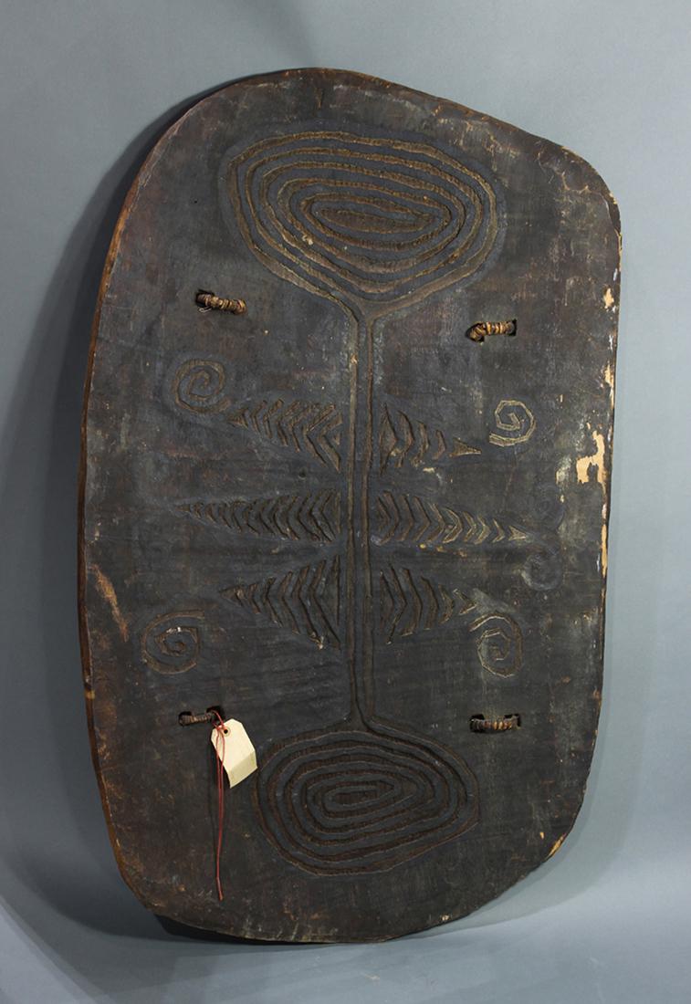 Simbai Papua New Guinea flat black shield: Simbai Papua New Guinea flat black shield, 48"h x 29"w. Provenance: Richard I.M. Kelton Collection, Marina del Rey, California