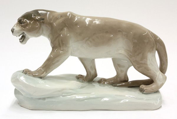 Czechoslovakian porcelain group: Czechoslovakian porcelain figural group, depicting a tiger in a naturalistic setting, his mouth open and in a stalking pose, marked on base and impressed Amphora, 9''h x 15''l