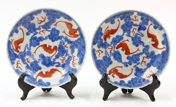 Pair of Chinese Enameled Porcelain Dishes, Qing: Pair of Chinese blue and red enameled porcelain small dishes with scalloped edges, late Qing period, well painted with bats amid tuffs of flame and framed by cobalt blue billowing clouds within a doub
