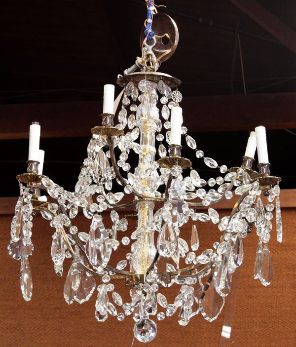 Italian crystal chandelier: Italian crystal chandelier, the nine light fixture having two tiers embellished with crystal swags conjoining the individial arms having faceted drop prisms, 30''h x 27''w